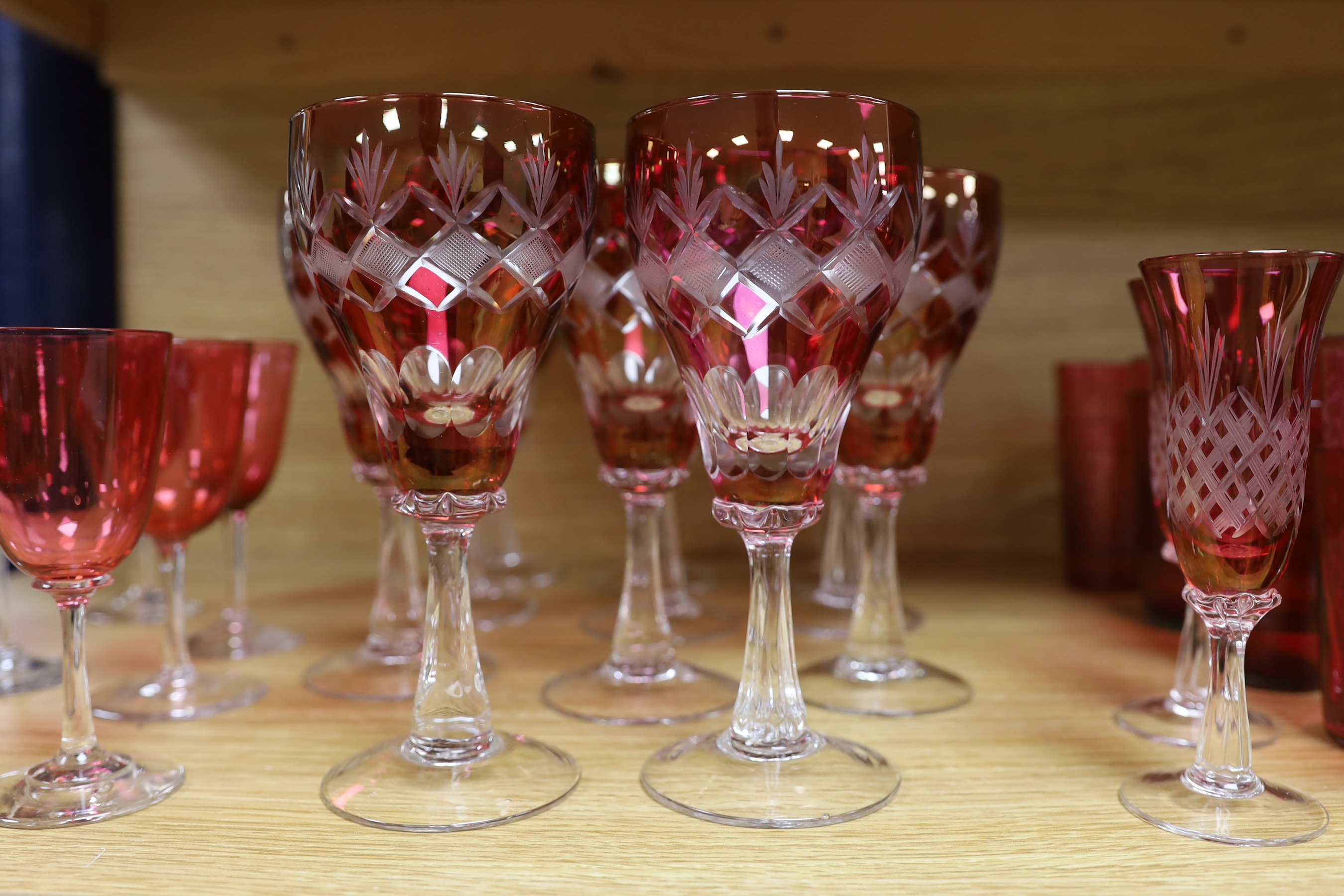 A set of ruby and green flashed glasses, tallest 18cm